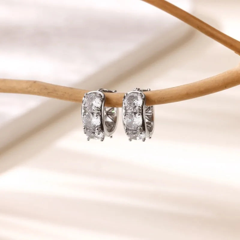Women's U-shaped clip earrings with zircon inlays on stainless steel, showing alloy clip mechanism