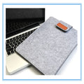Dark grey clamshell laptop bag showing interior with polyester lining and corner protectors
