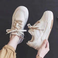 Low-top sneakers in beige and pink with 2.5cm rubber sole and imitation leather lining