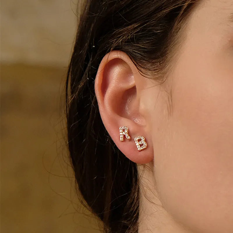 Gold plated earring featuring the letter A from the alphabet, with a small zircon stone detail.