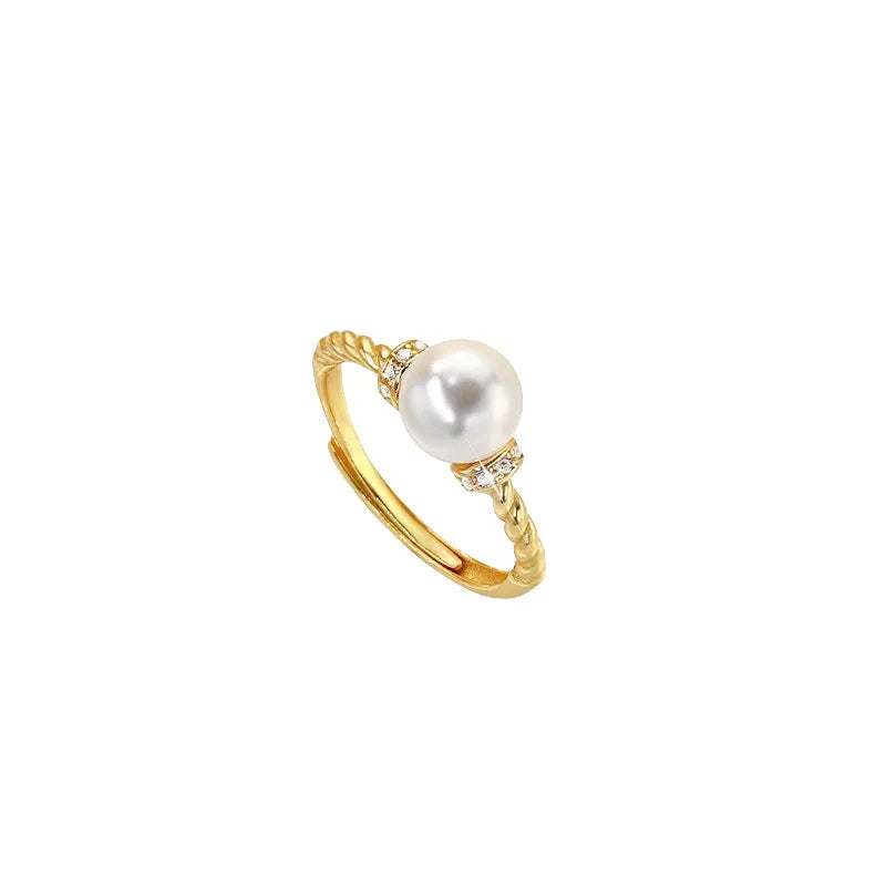 Adjustable copper ring with geometric pearl inlay in antique twist pattern, showing gold and silver finish options