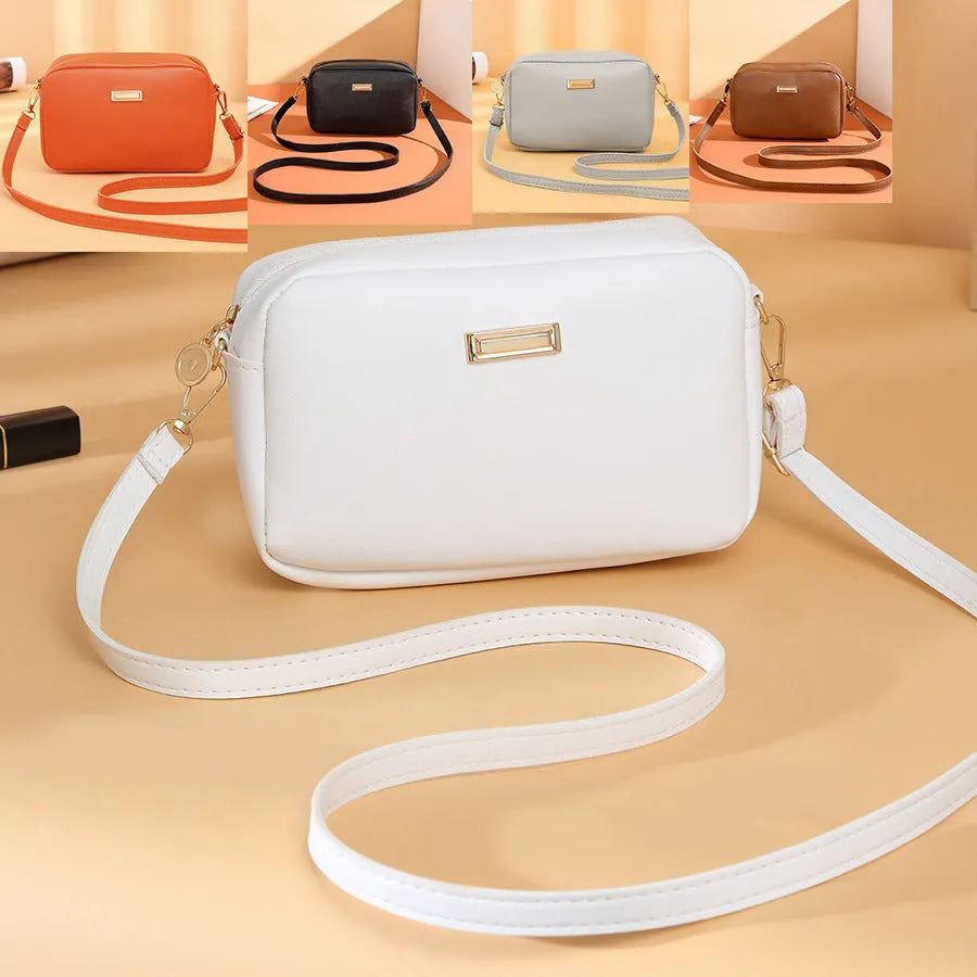 Women's solid colour PU shoulder bag with three-dimensional pocket in orange red, showing horizontal square shape and urban simplicity style
