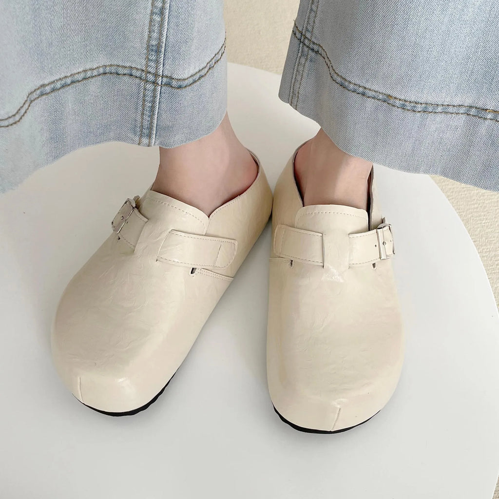 Flat buckle casual sneakers in yellow, creamy-white, silver, and black colours, showing round toe and PU upper.