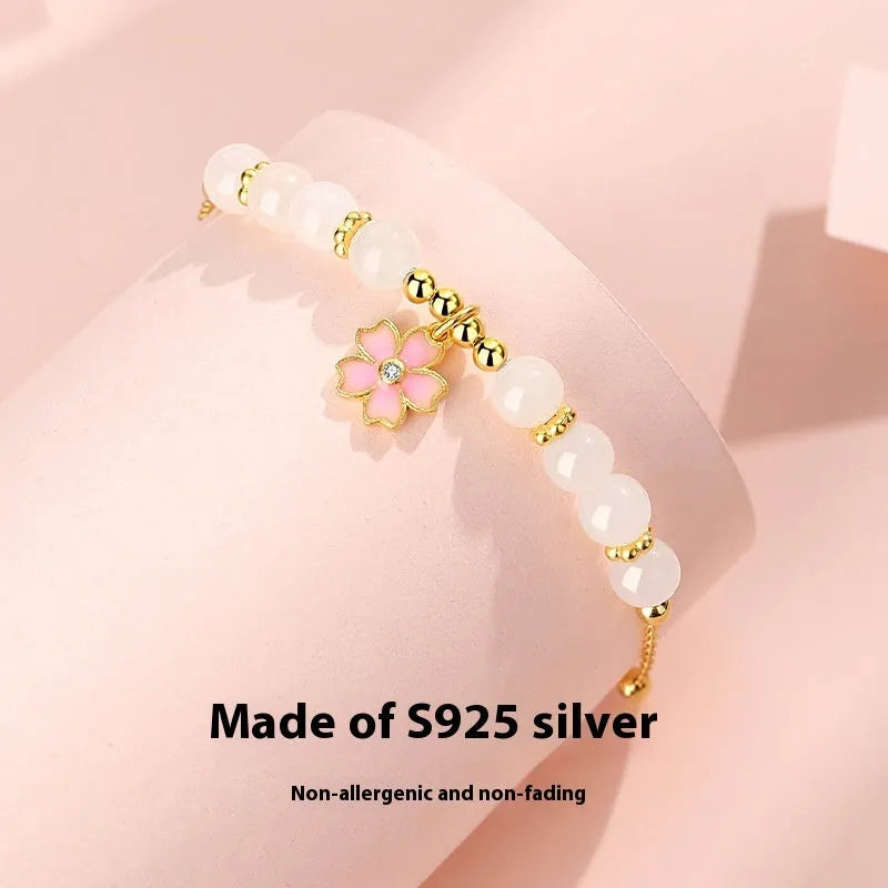 Women's pink bracelet with S925 silver cherry blossom pendant and Hetian jade beads in sweet floral style
