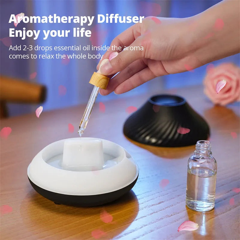 Beige USB aromatherapy diffuser with flame effect lighting on wooden table