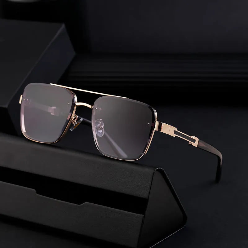 A pair of men's vintage-style sunglasses with UV-protective PC lenses, shown in a gold double gray colour variant.