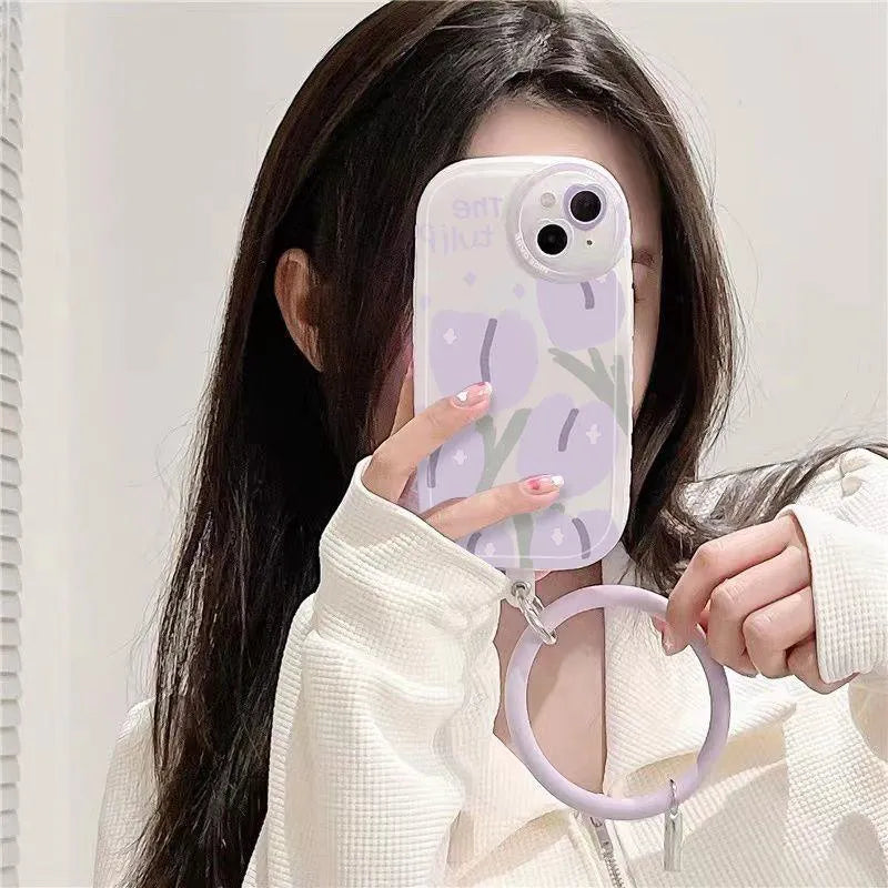 Purple tulip transparent iPhone case with heart-shaped camera detail and matching adjustable bracelet