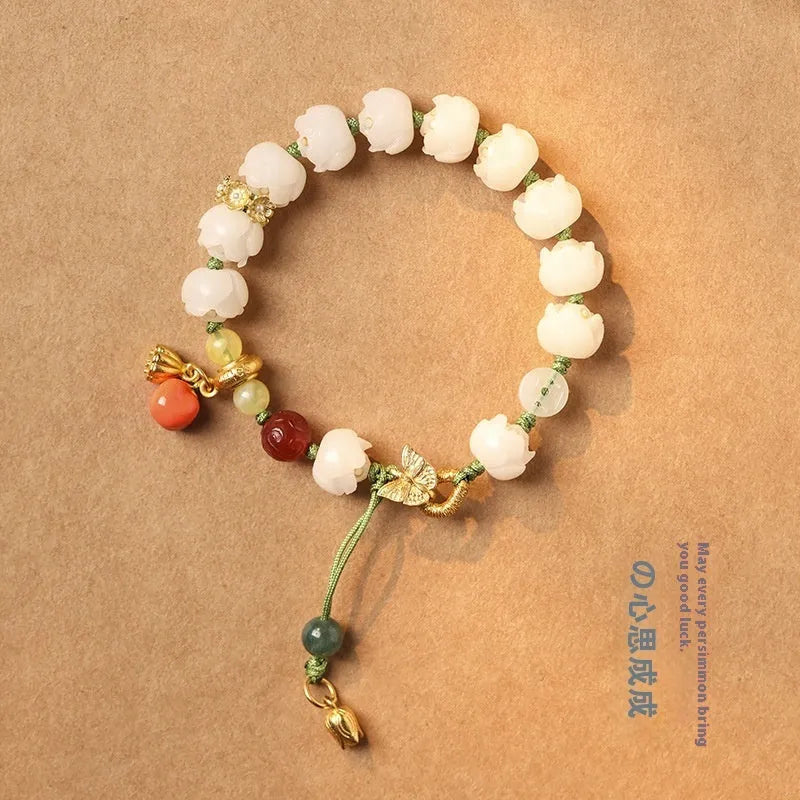 Hand-woven white jade Bodhi bracelet with lucky persimmon charm and three bead sizes on open rope