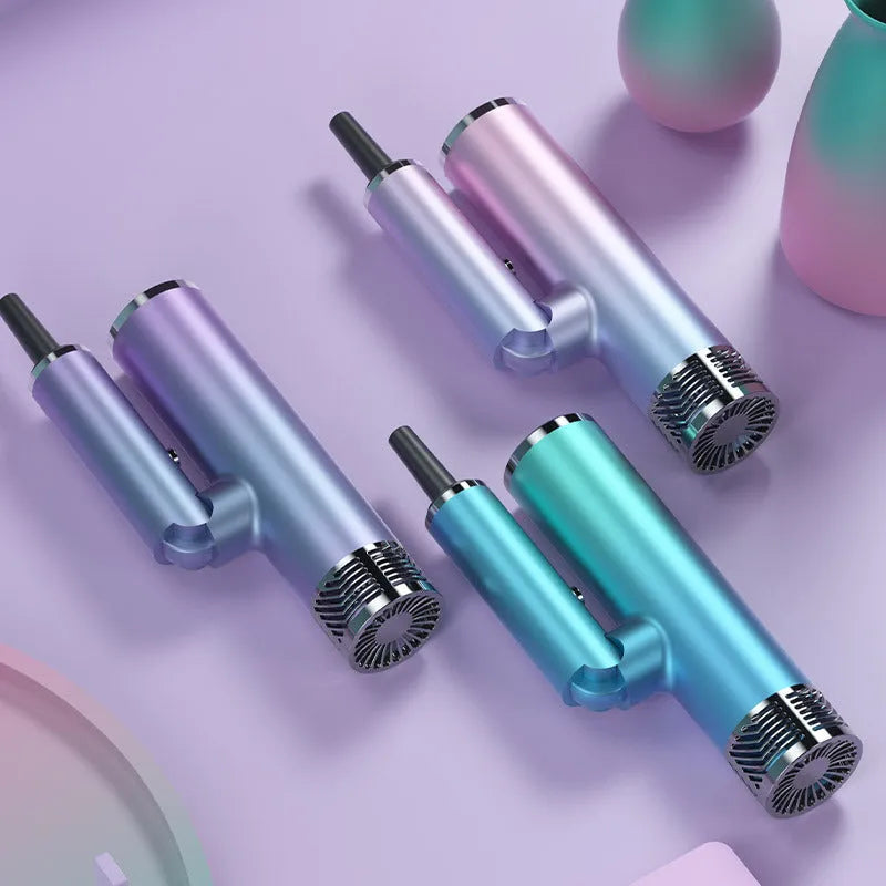 Green and purple foldable hair dryer with compact, lightweight design for travel.