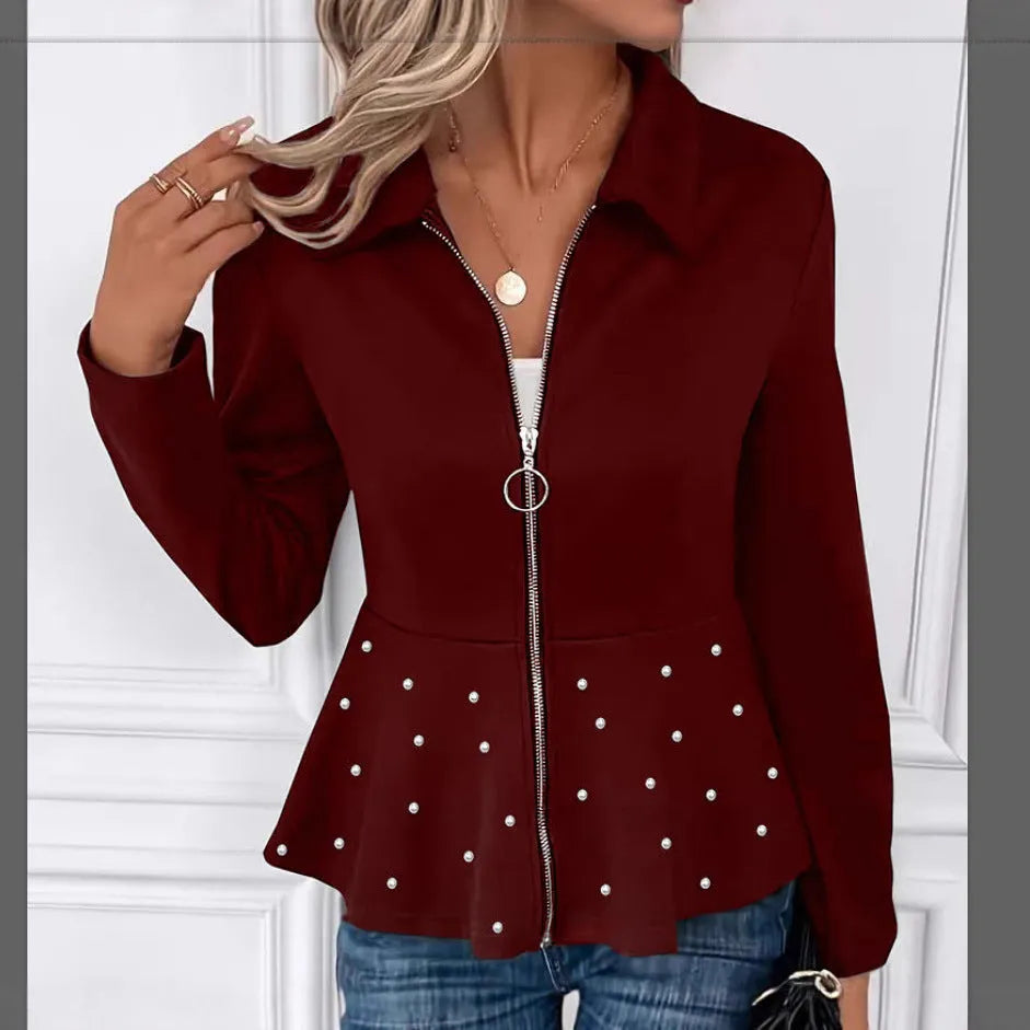 Women's loose-fit black coat with heavy-duty beaded zipper and ruffled hem, long sleeves.