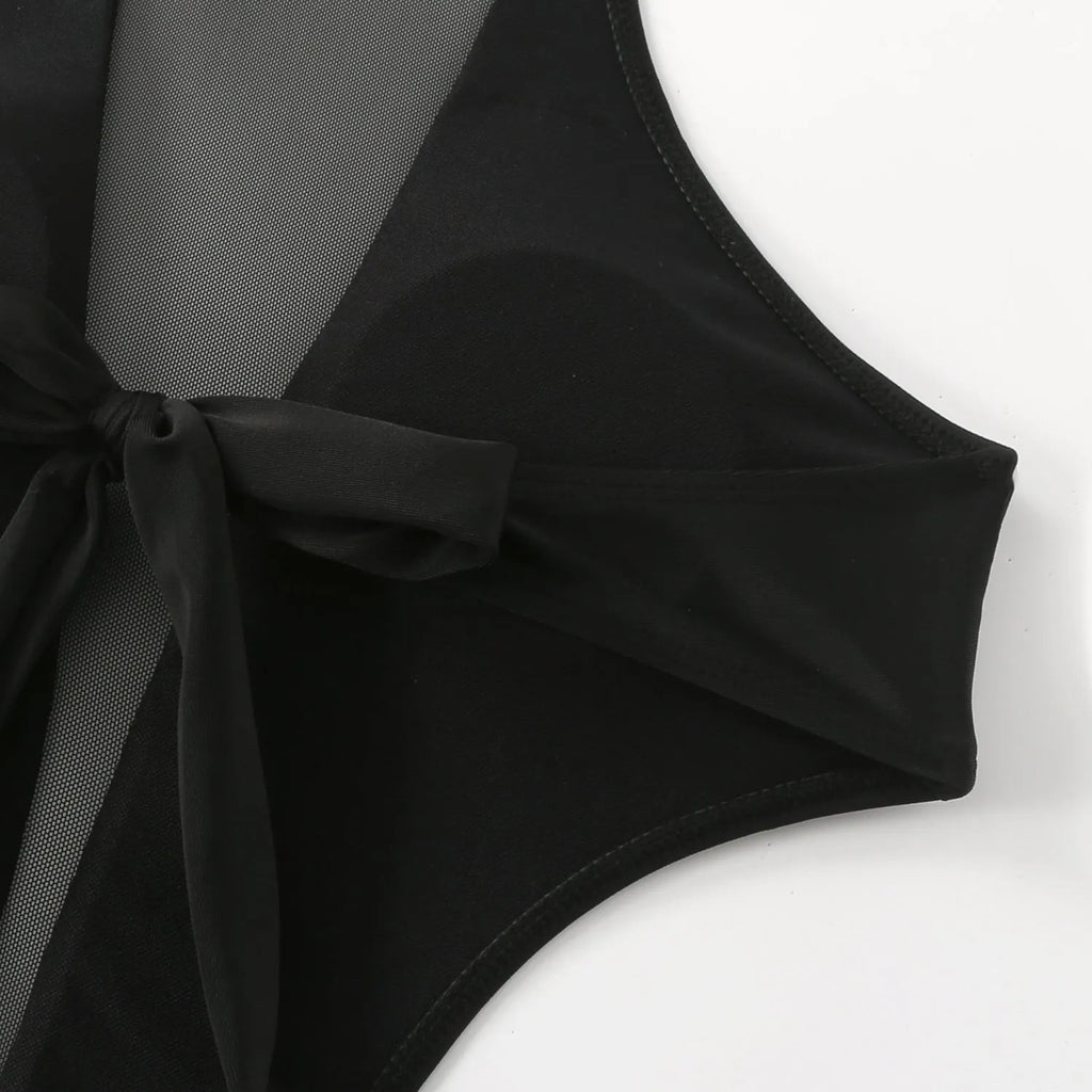 Black one-piece swimsuit for women with an open back design and hollow-out detailing on the straps