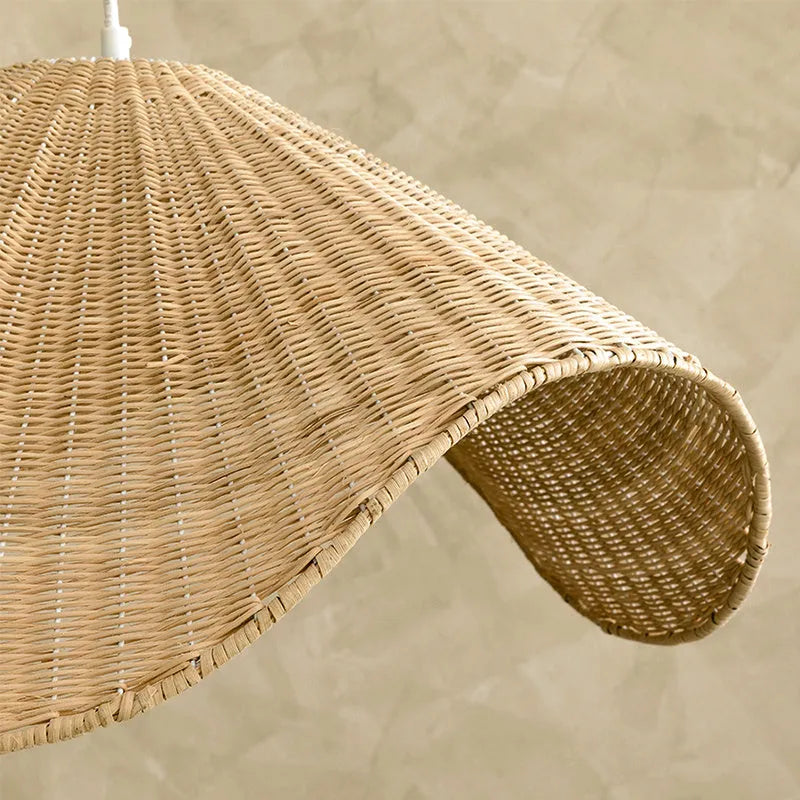 Handmade natural rattan and willow chandelier with warm LED light in three size options.