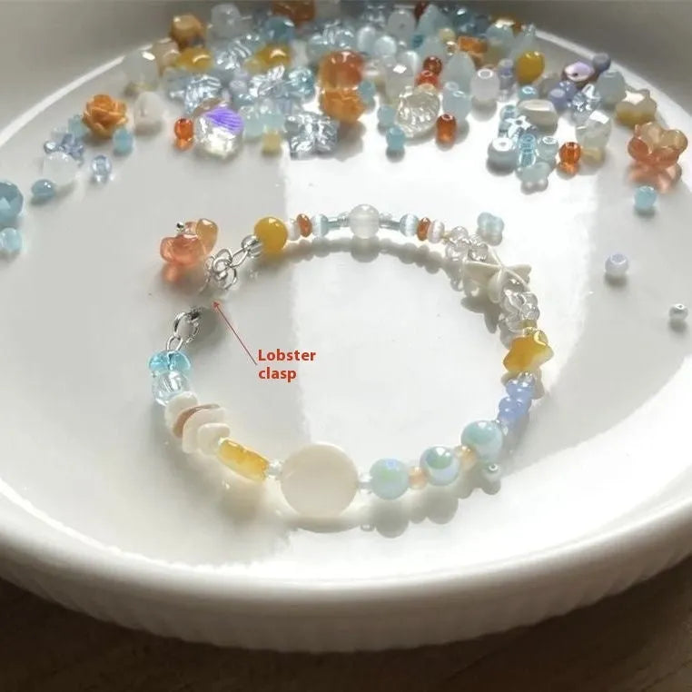 Water-soaked Bracelet Orange Sea Summer Dopamine Seaside showing diamond shapes and round elements on alloy band