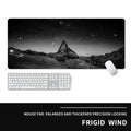 Oversized gaming mouse pad on desk showing 900x400mm dimensions with cold style design and natural rubber base