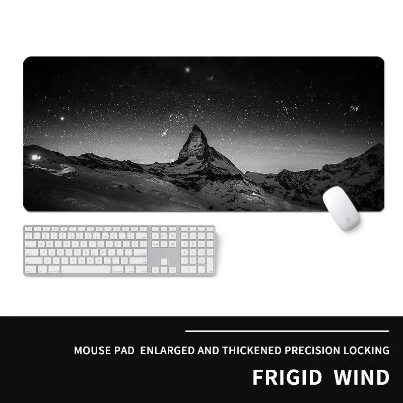 Oversized gaming mouse pad on desk showing 900x400mm dimensions with cold style design and natural rubber base