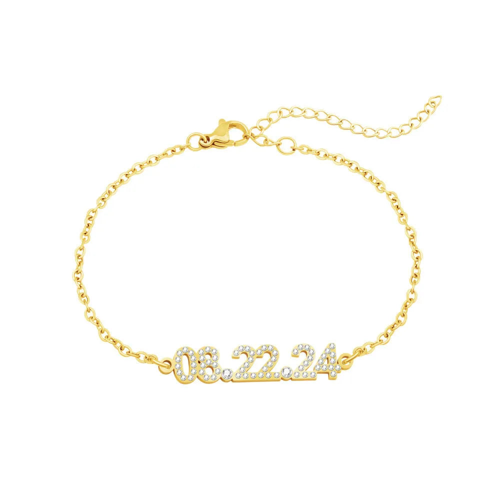 Stainless steel digital bracelet with crystal-set bezel showing time display, alongside matching necklace option.