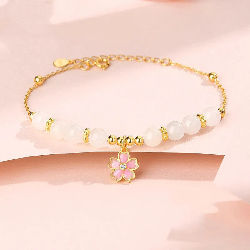 Women's pink bracelet with S925 silver cherry blossom pendant and Hetian jade beads in sweet floral style