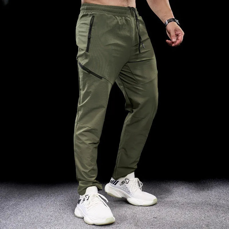 Men's waterproof quick-dry nylon workout trousers in multiple colours for sports and fitness activities