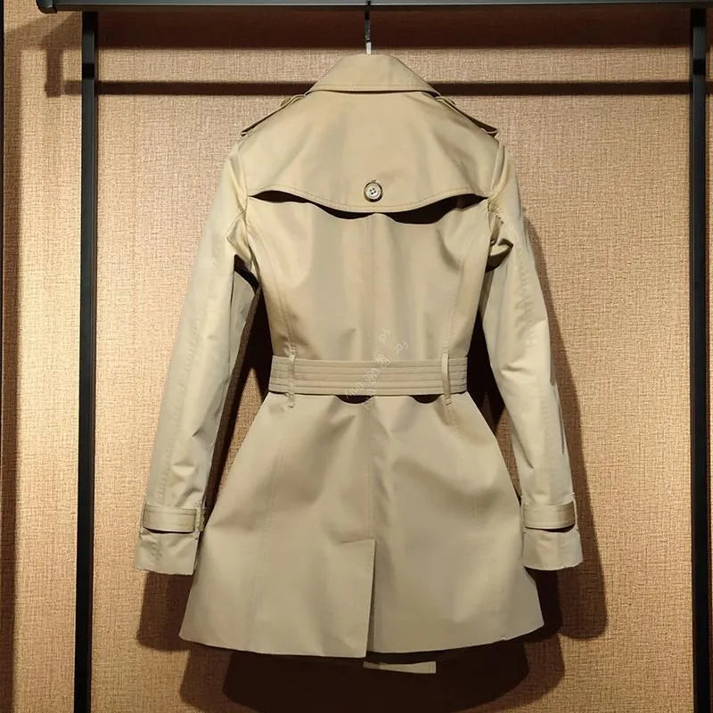 Khaki women's trench coat with double-breasted button front and distinctive flight sleeves