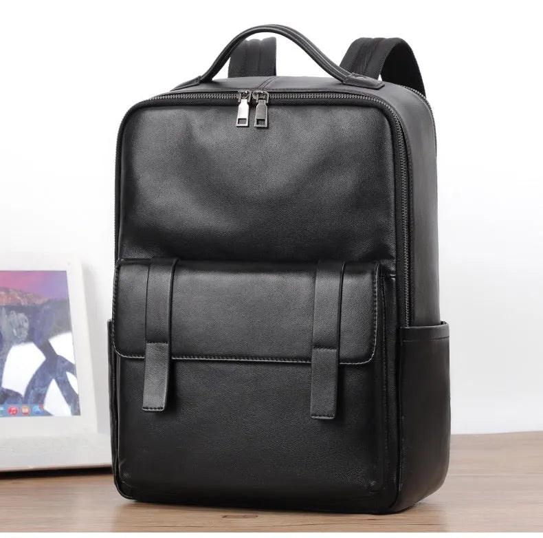 Men's black genuine leather large capacity computer backpack with woven details.