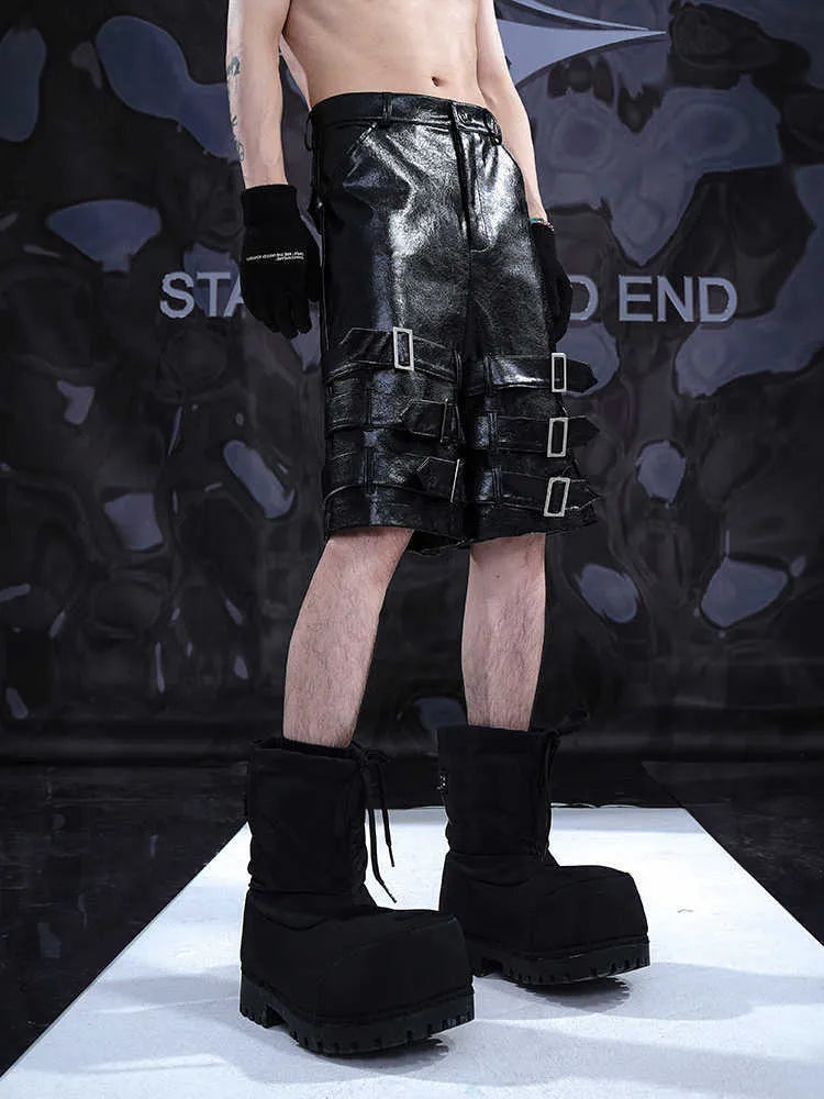 Men's black PU leather cropped shorts with medium-low waist, showing polycarbaminate fibre construction and contemporary design