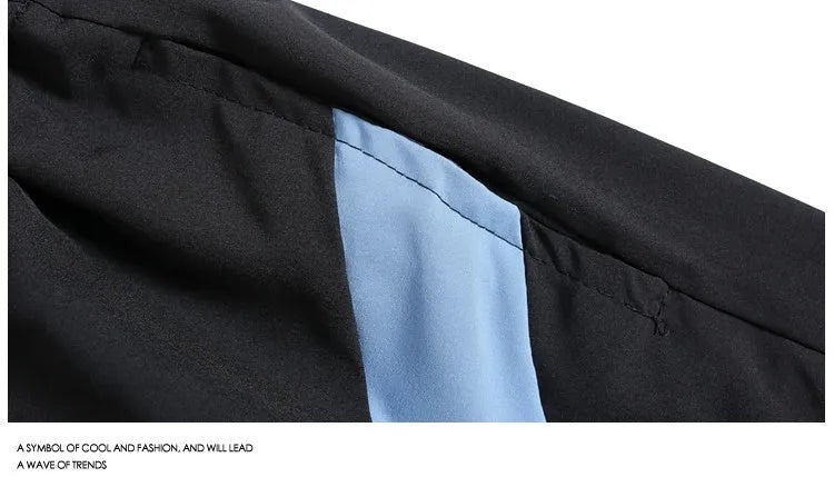 Loose-fit quick-drying sports shorts in black with elastic waistband and above-knee length