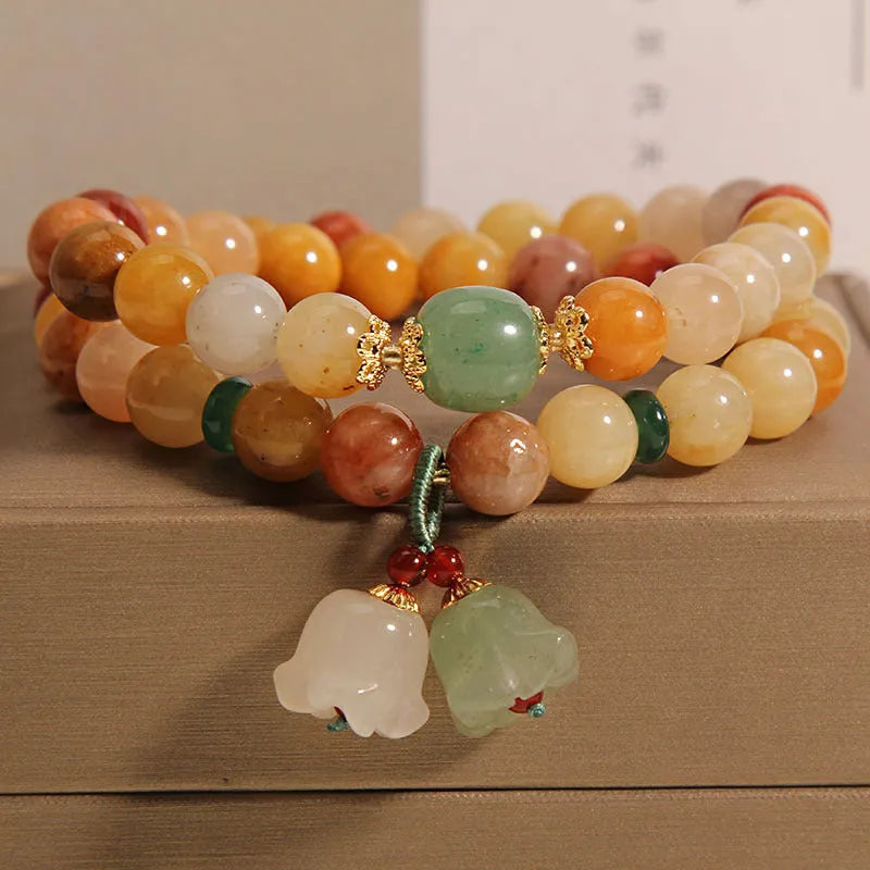 Natural jinsi jade multi-layer bracelet for women showing adjustable knotted design with orchid pendant detail