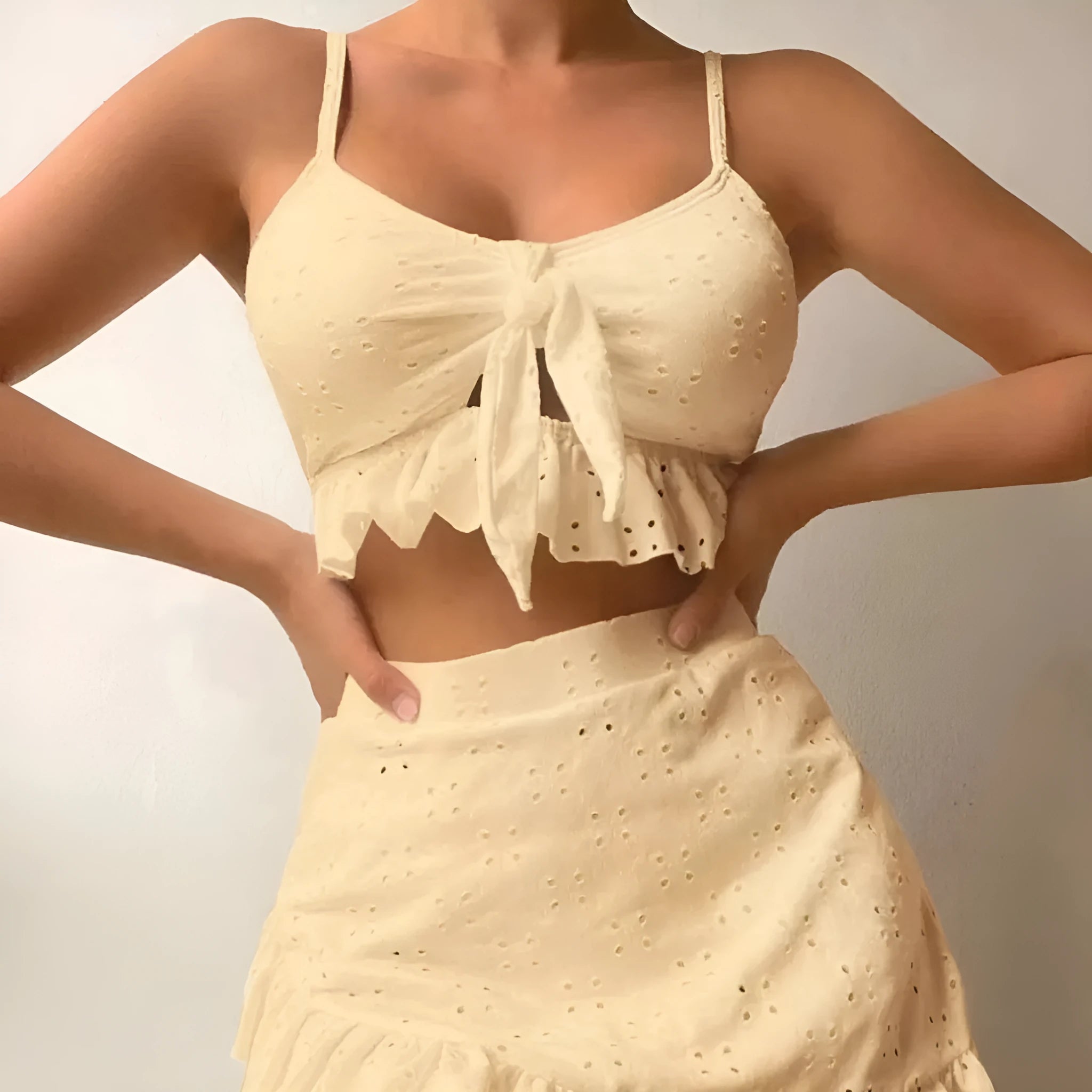 Women's solid colour split hip skirt bikini swimsuit three-piece set on a mannequin.