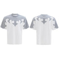 Men's cotton short-sleeved shirt with burnt flower detailing and stitching on a grey background