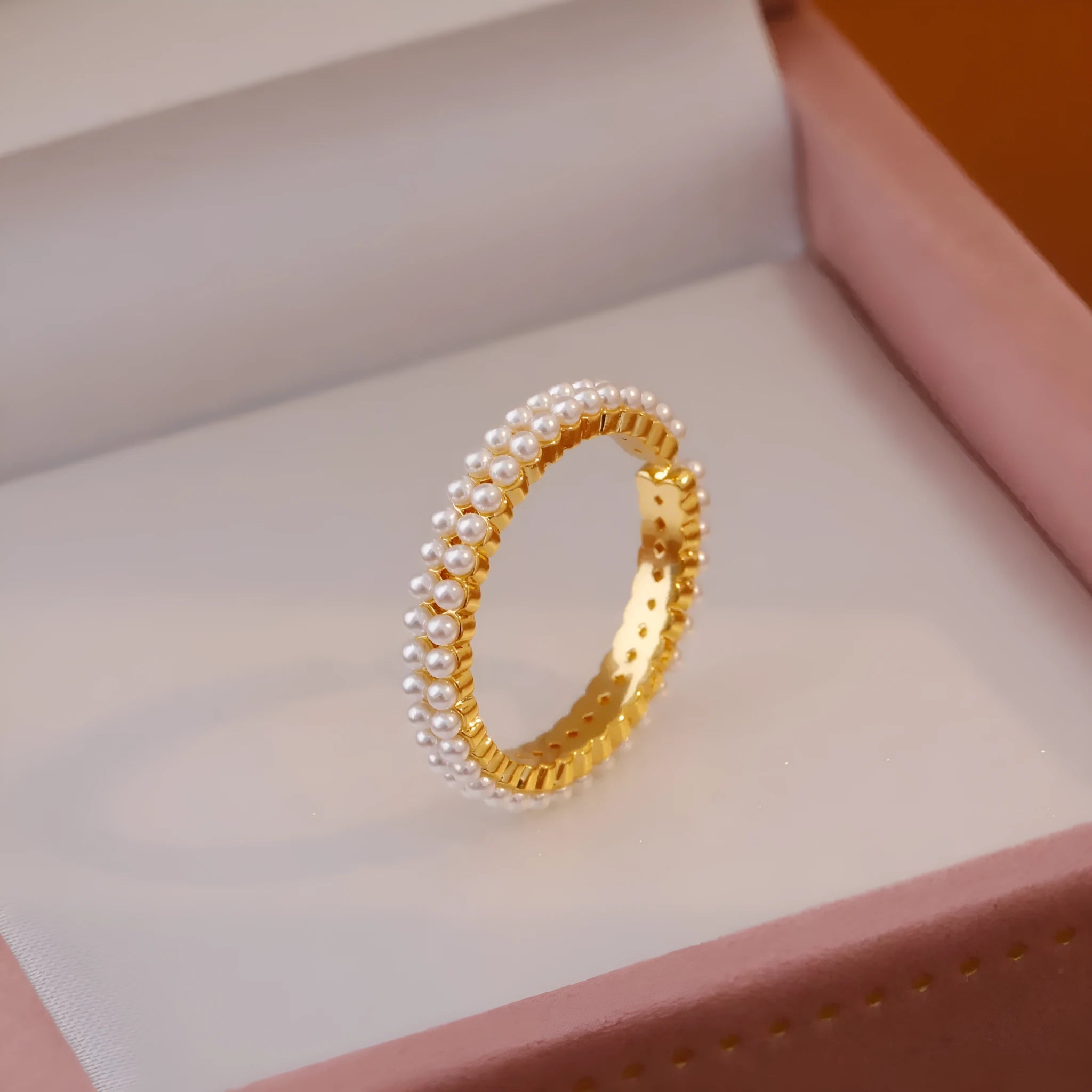 Gold-coloured geometric open-mouth ring with pearl detailing on copper electroplated band