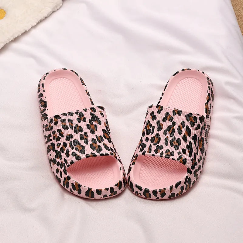Leopard print slippers with thick EVA sole showing slip-on design and animal pattern details