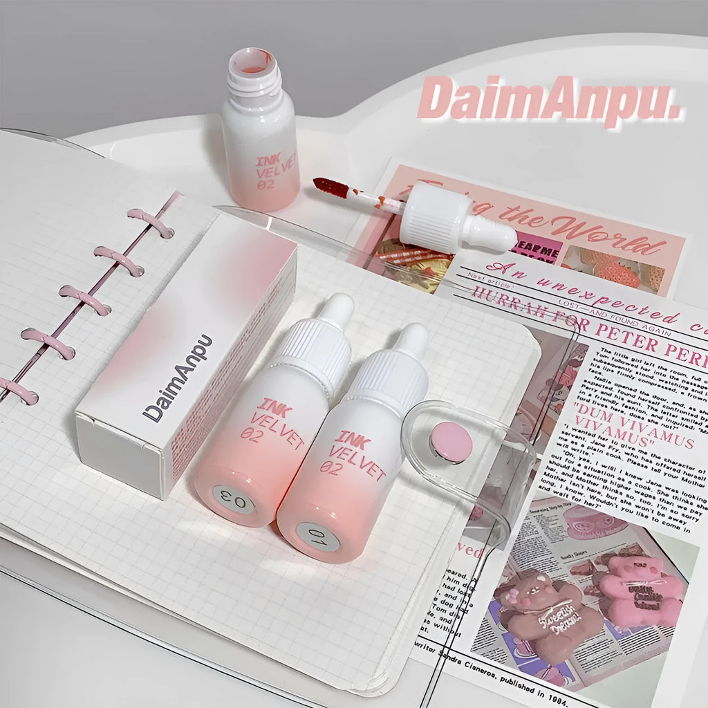 Mirror Lip Lacquer moisturising lip gloss tube in sheer shades on a plain background.