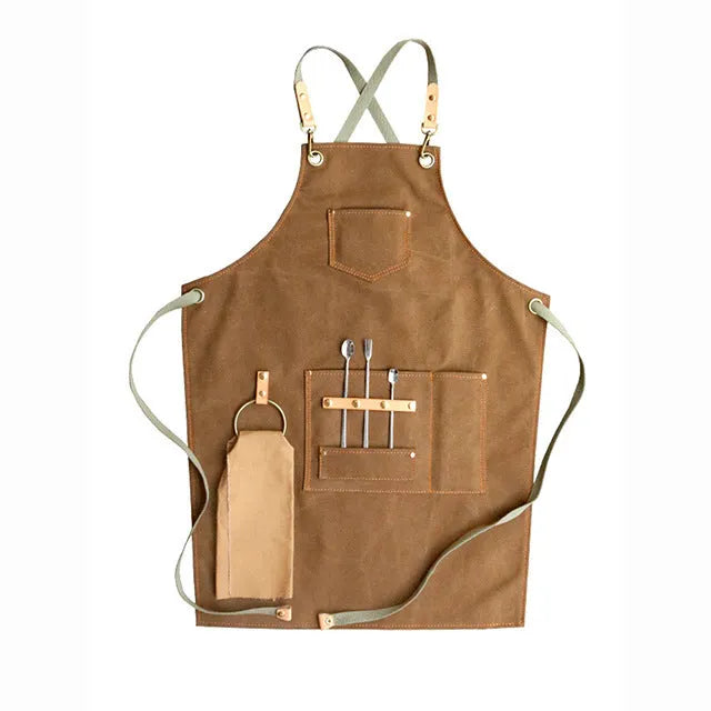 Canvas apron with cross-back straps in camel colour, shown on a person for milk tea shop or cafe use