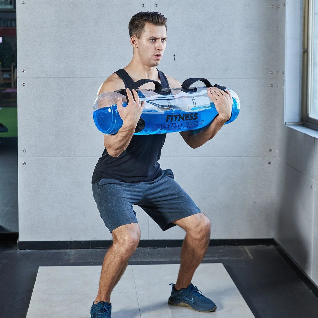 Transparent PVC water filled weight bag showing water level, approximately 50cm length, with inflation valve and soft construction for strength training