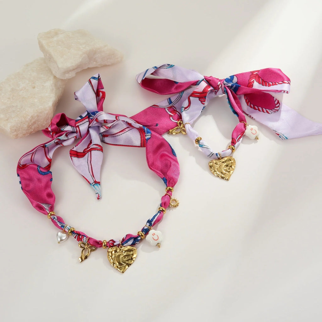 Geometric love pendant necklace and matching bracelet set with colourful silk scarf design on 18K stainless steel chain.