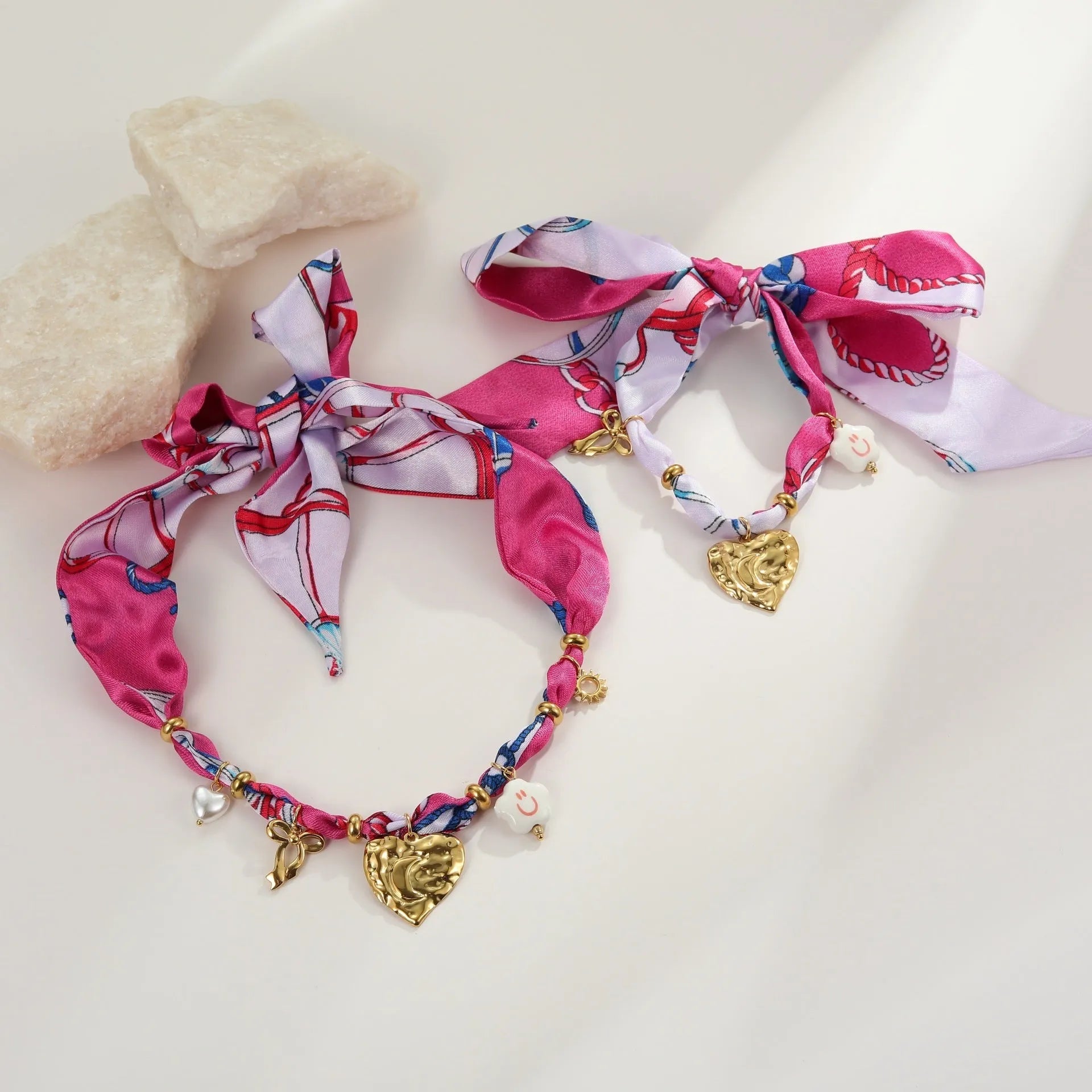 Geometric love pendant necklace and matching bracelet set with colourful silk scarf design on 18K stainless steel chain.