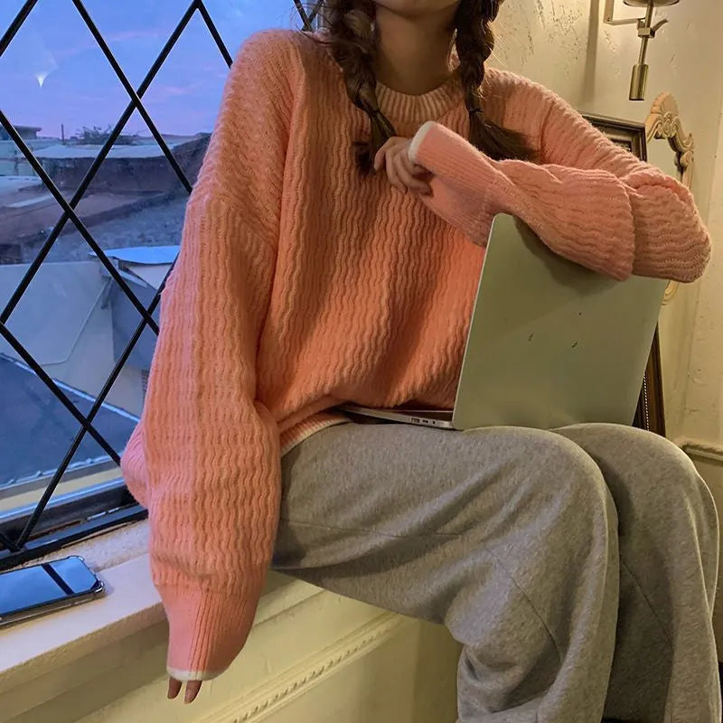 Women's loose pullover sweater in lake blue, made from 100% polyester, showing regular sleeves and solid colour design.