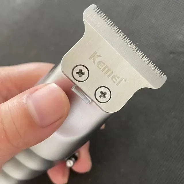Barber scissors with LCD display showing rechargeable KM-5027 model with stainless steel tool head