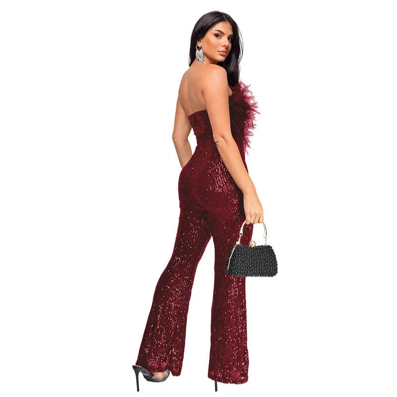 Women's black sleeveless backless jumpsuit with flared legs and sequin detailing, showing front and back views