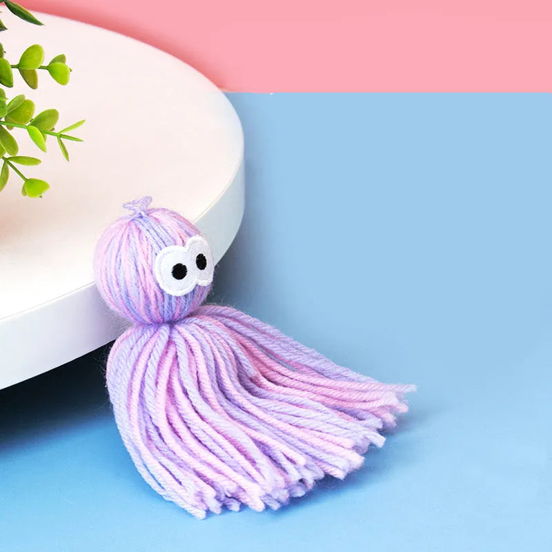 Cat toy wool ball measuring 10x13x4cm with hanging cord and teaser stick attachment in three colour options