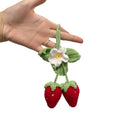 Handmade strawberry weaving car pendant with cotton hemp materials showing detailed stitching