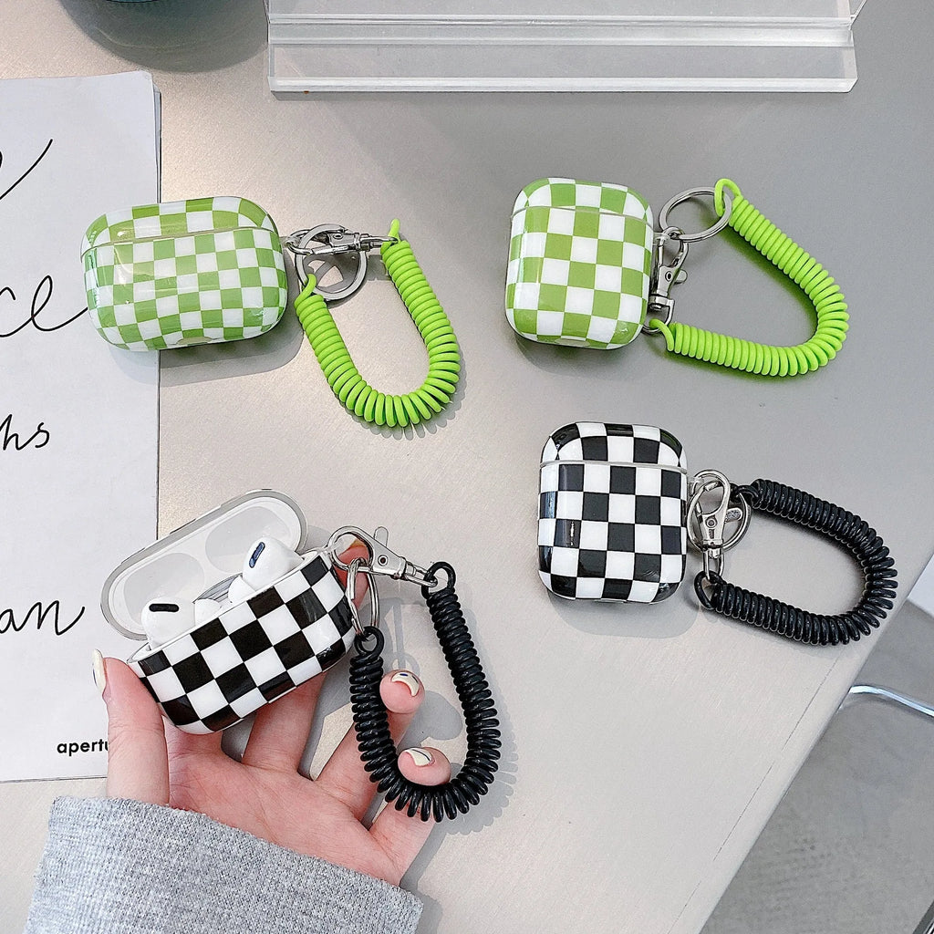 Checkerboard pattern TPU protective case cover for Apple AirPods charging case in black and green.