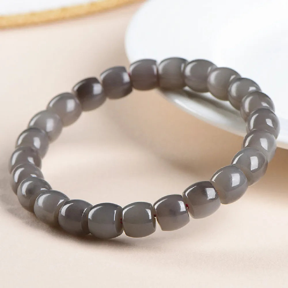 Natural smokey violet Hetian jade straight cut bracelet with 24 beads measuring 8x9mm