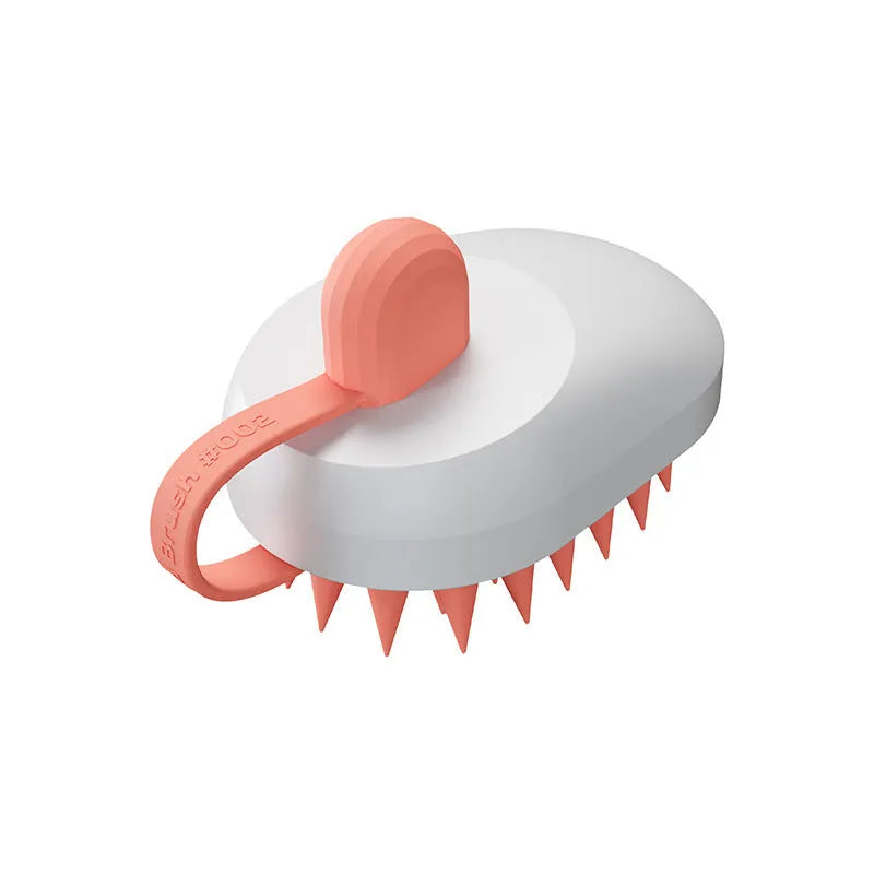 Soft silicone pet hair remover and massage brush for dogs in blue, held in hand.