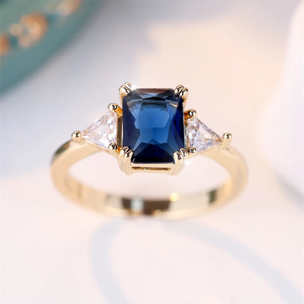 Gold sapphire blue rectangular copper ring for women showing geometric shape and metallic finish