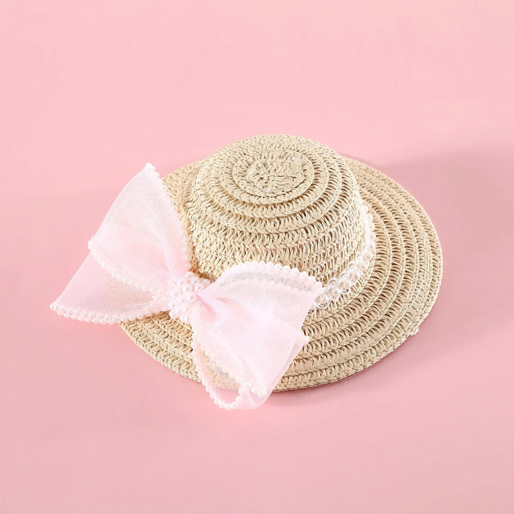 Pet cat wearing a straw hat with pearl bow in blue, sizes 13cm and 15cm, made from Lafite leaves.