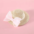 Pet cat wearing a straw hat with pearl bow in blue, sizes 13cm and 15cm, made from Lafite leaves.