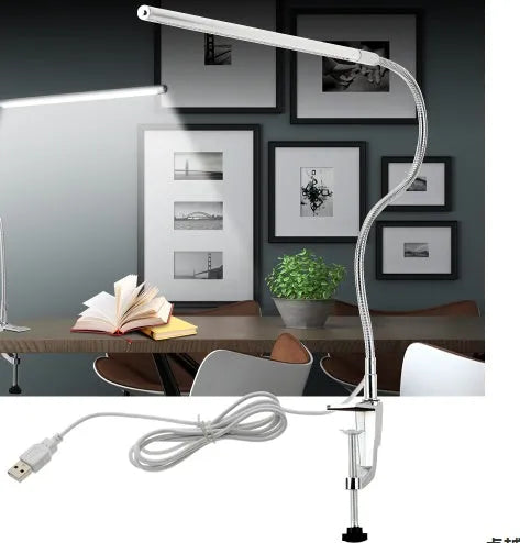 Silver aluminium alloy USB LED nail lamp with long arm and clip-on base, lit with bright white light.