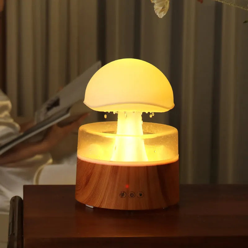 White rain cloud shaped humidifier with rainfall simulation and colour changing night light functions