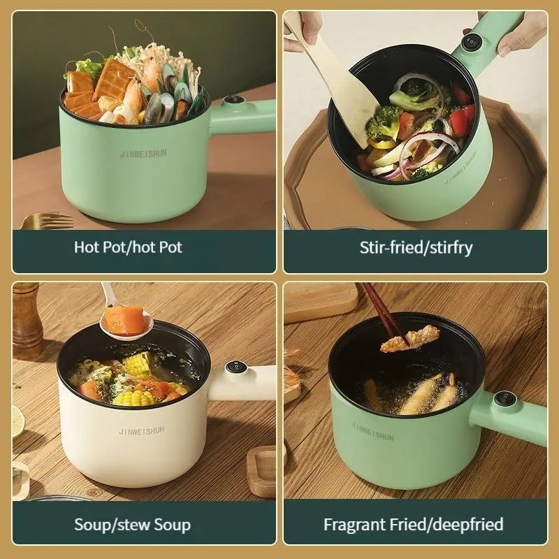 White and green mini electric hot pot cooker with stainless steel body and cooking accessories on a kitchen counter.